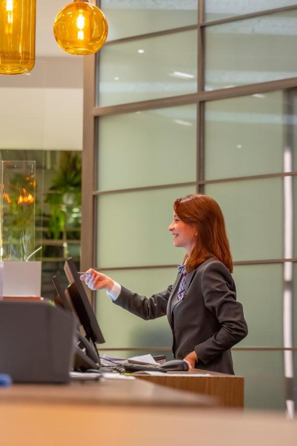 Mercure Trabzon Hotel Exterior photo A receptionist at the reception desk of a hotel